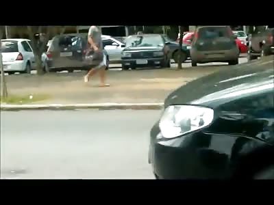*BRAZIL* ROAD RAGE: Biker barely escapes being ran over after kicking woman's side mirror