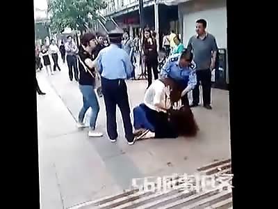 Cat-fight between two Asian women.