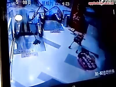 MAN ALMOST SWALLOWED BY ESCALATOR IN CHINA