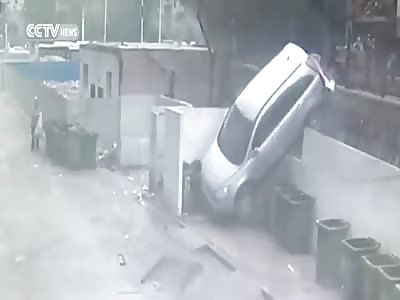 CAR NOSEDIVES AFTER CRASHING INTO GUARDRAIL