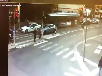 WOMAN IS RUN OVER BY CAR