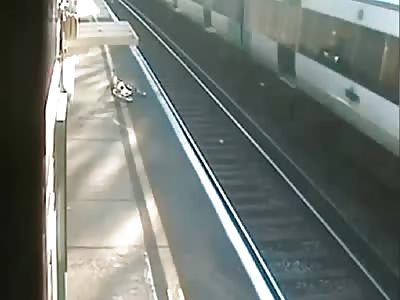 CYCLIST NEARLY HIT BY TRAIN