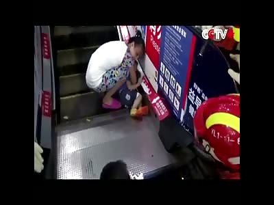 TODDLER WITH HAND STUCK IN ESCALATOR