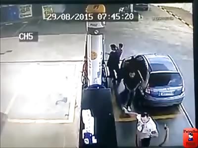 GAS STATION ROBBERS RUN OVER AND DRAG ATTENDANT'S BODY IN THE ESCAPE