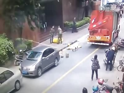 Watch the Moment a Female Suicide Jumper Hits the Sidewalk Almost Crushing these Workers 