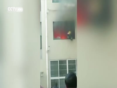 FLAMING FIREFIGHTER JUMPS OUT OF BURNING APARTMENT