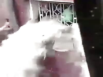 MEN RESCUE PEOPLE TRAPPED IN FLOODED BUILDING
