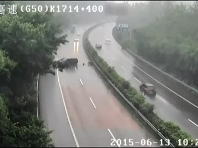 Truck Driver Flips Truck & Blocks Highway Trying to Avoid Vehicle  China Wet Road Car Crash