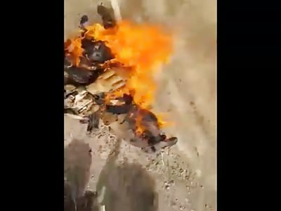 Burning  isis terrorist by Iraqi Patriots