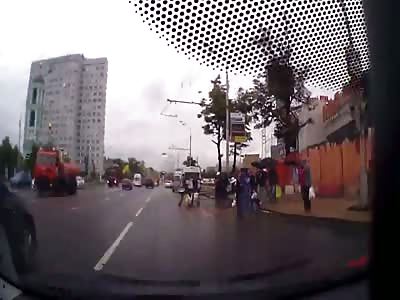 Very close call for these people crossing the road..