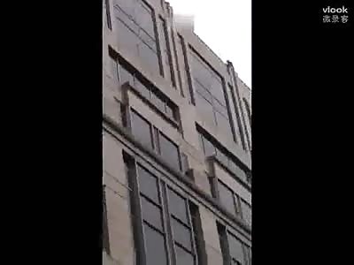  Knife-wielding man falls off building
