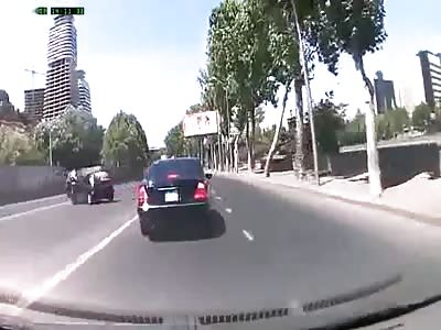 Idiot making a U-turn sends biker and his passenger flying  