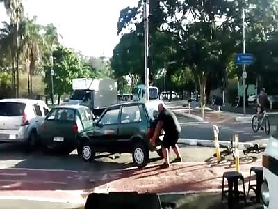 Man Lifts Car Parked On Bicycle Path