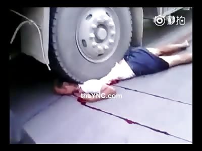  Woman crushed to death by Truck.