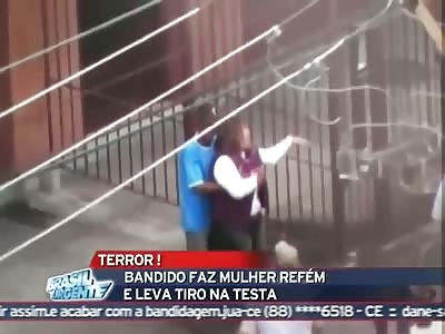Brasillian bandit gets a clean headshot while taking hostage