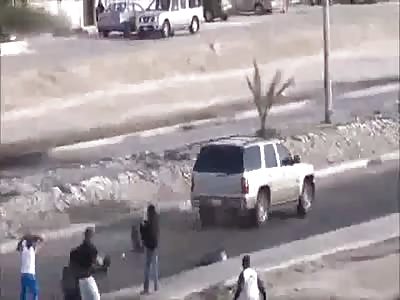 groupe of protesters trying to block the road get rammed by a mad driver 