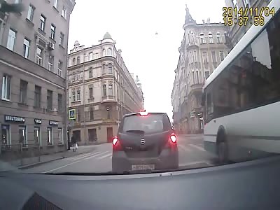 Van flips over and nearly wipes out 2 people 