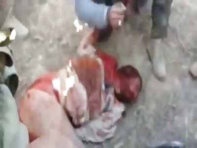 Struggling Man is Brutally Beheaded By Militia (New Footage)