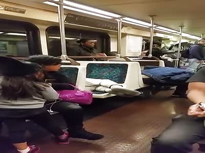 Hysterical black woman is punched in the mouth on the train