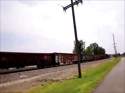 A long limo attacked by a longer train