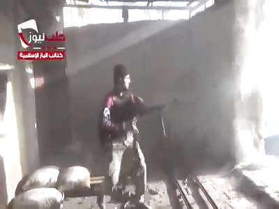 Syria.Mad terrorists - ISIS shoot from a machine gun