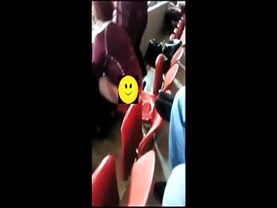 Woman Pee on the Stadium Seat During Game!