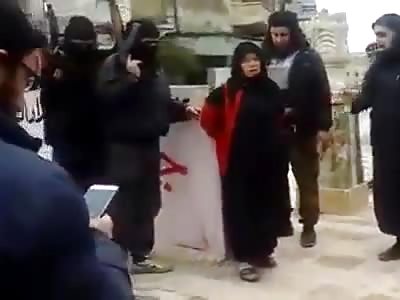 ISIS execute a woman in public