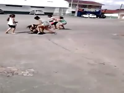 a group of women beat another woman in front of her own mother