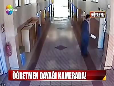 Teacher beating up students