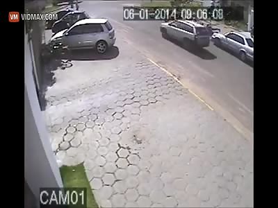 Brazilian thief gets run over by a car while trying to rob someone.