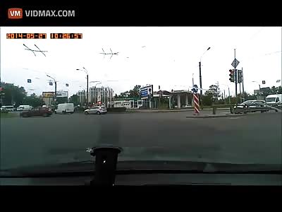 Motorcycle driver sent flying after a car pulls in front of him.