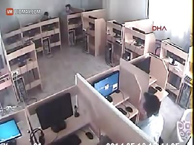 Brutal beating with a stick in internet cafe.