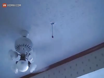 Moron attempts to bite something as fan blades spin and ends up with a perforated eardrum.