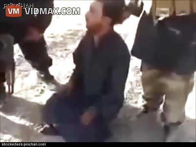 Brutal beheading of a Saudi man after he is interrogated.