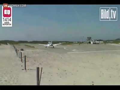Plane landing on a German beach nearly lands on a guy sunbathing.