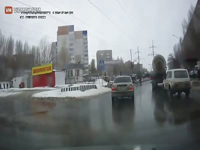 Russian man tries to commit suicide under a truck's wheels.