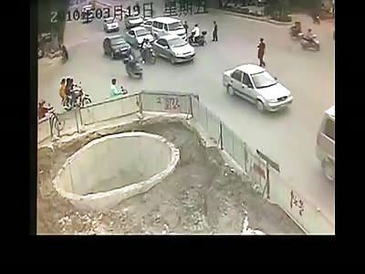 Scooter falls into well after crashing 4 times, China.