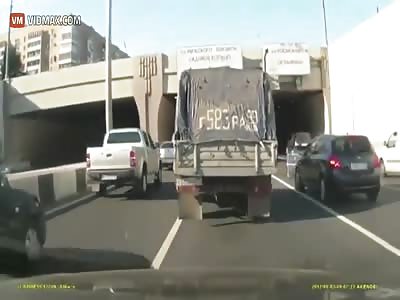 Drunk Russian decides to take a shopping cart for a spin on the highway.