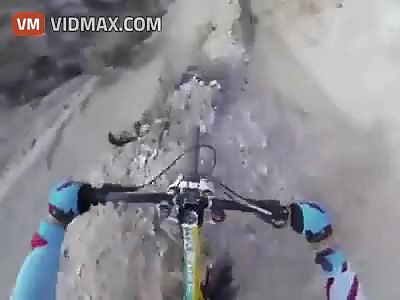 Heart meet floor! Guy takes the most insane downhill cycling course I've ever witnessed