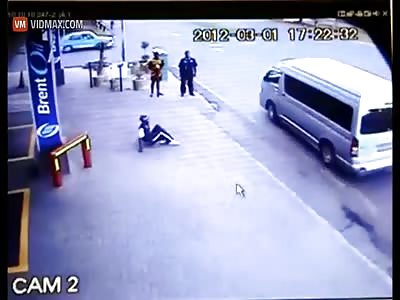 van driver runs over a pedestrian on the sidewalk then kicks him in the face.