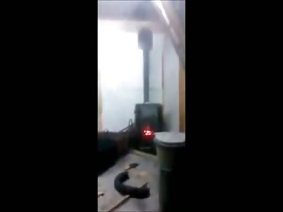 Idiot Throws an Aerosol Can Into a Woodburning Stove